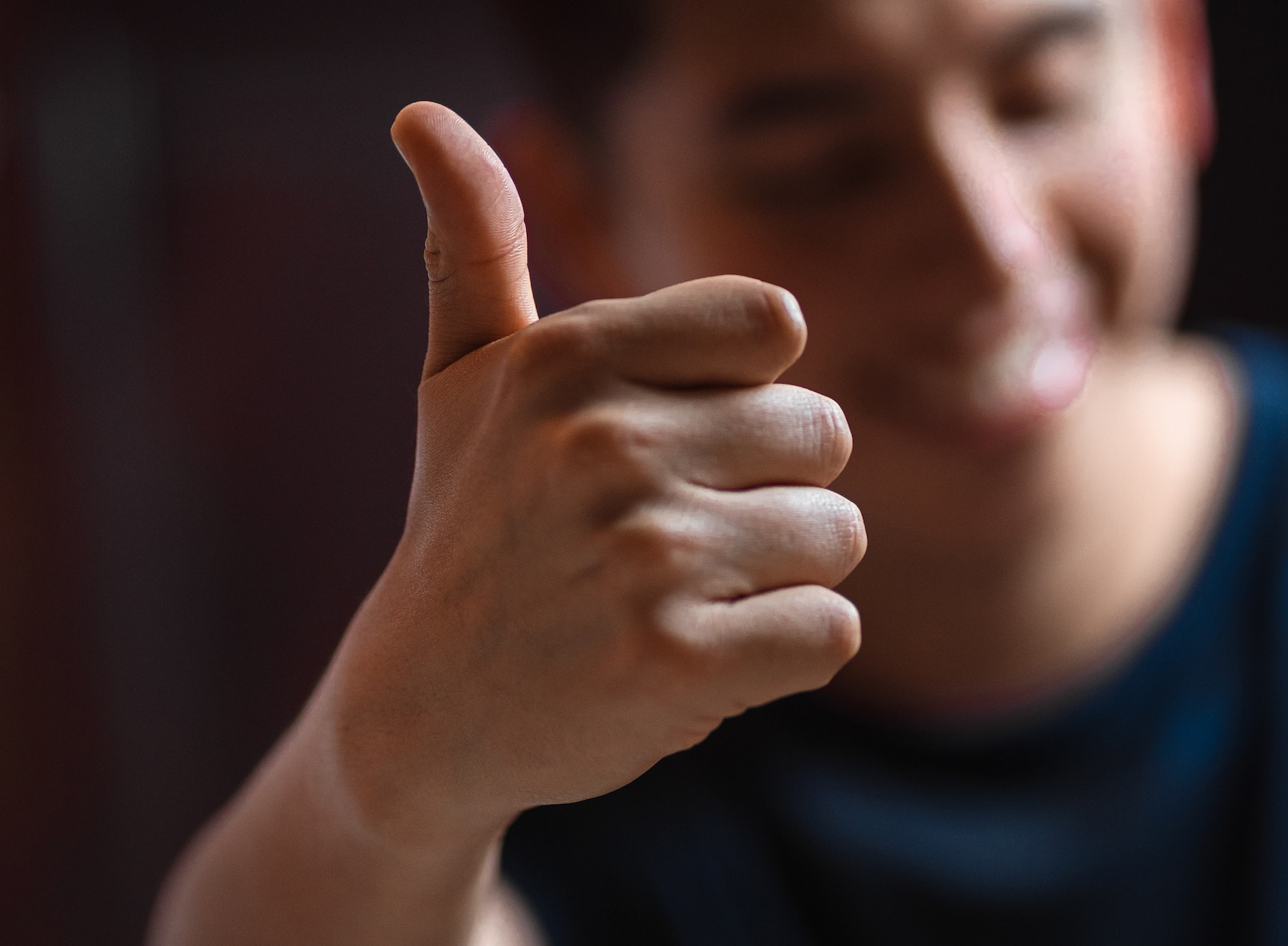 man with thumbs up spreading positive messages and positive thinking