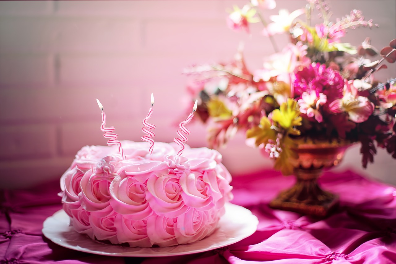 pink cake over pink themed birthday table for happy birthday girlfriend messages