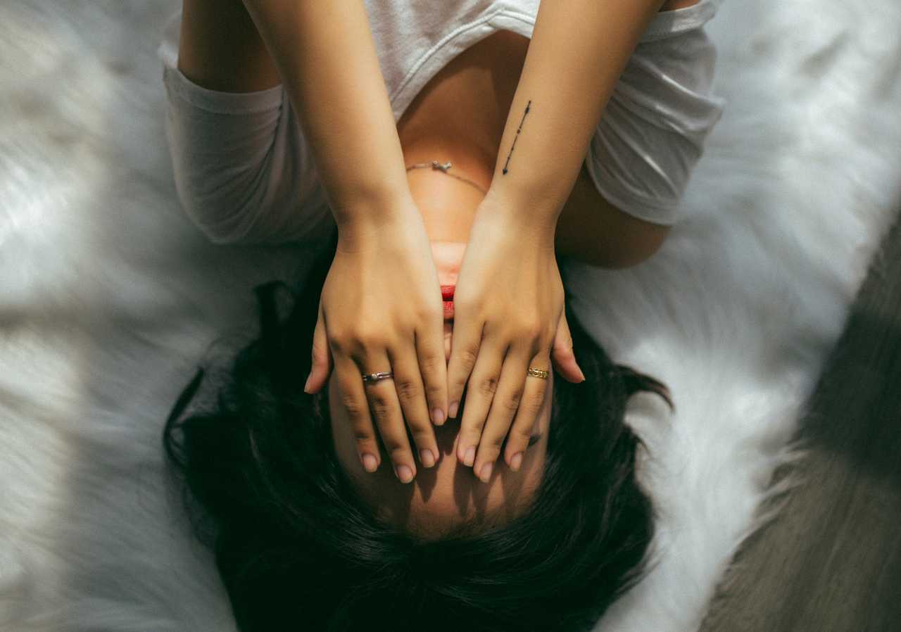woman laying in bed sad after receive break up messages for girlfriend
