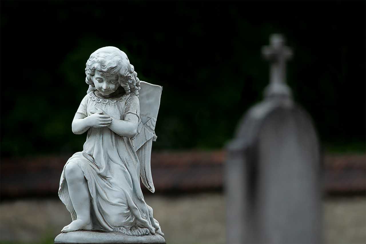 stone angel over the grave for sympathy messages