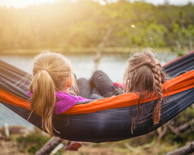 sisters laying in an amok by a lake to share sister quotes