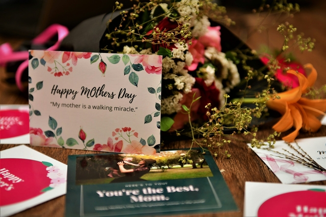 happy mother's day quotes and messages in a card together with other mother's day gifts in a table