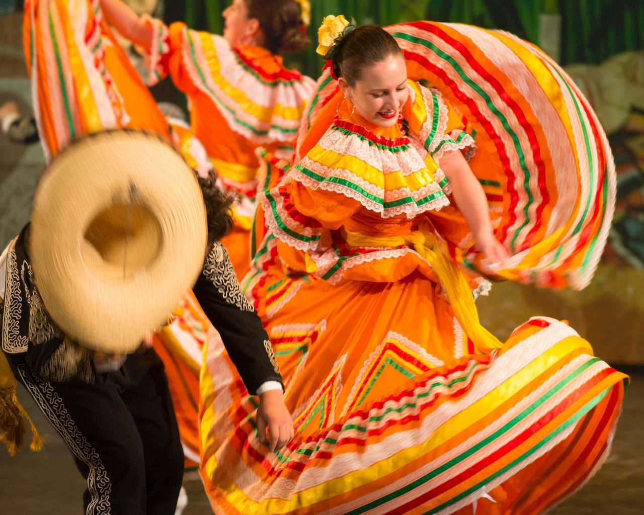 mexican dancers with traditional costumes on cinco de mayo celebrations