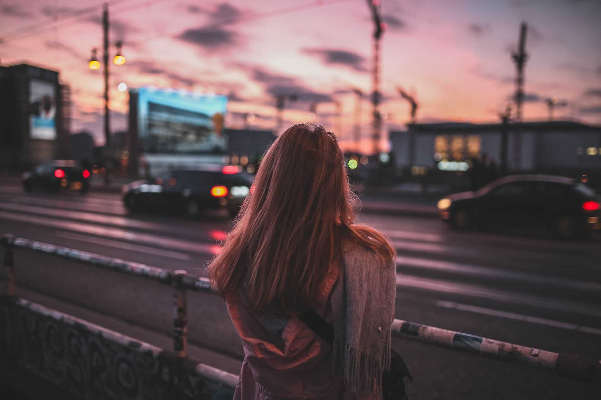 woman starring at a street starring after getting break up messages for girlfriend