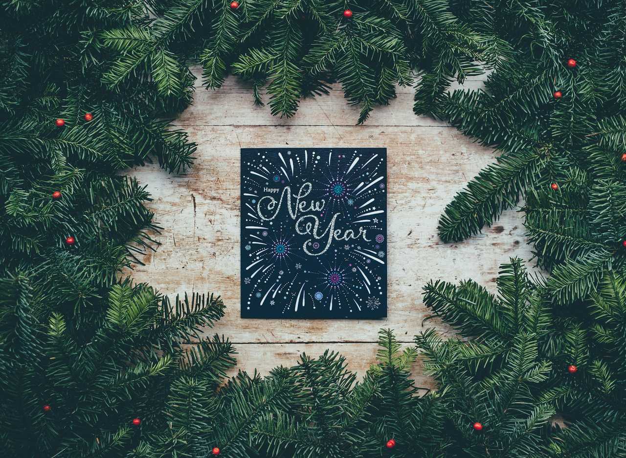 new year holiday greeting card surrounded by end of year holidays decorations