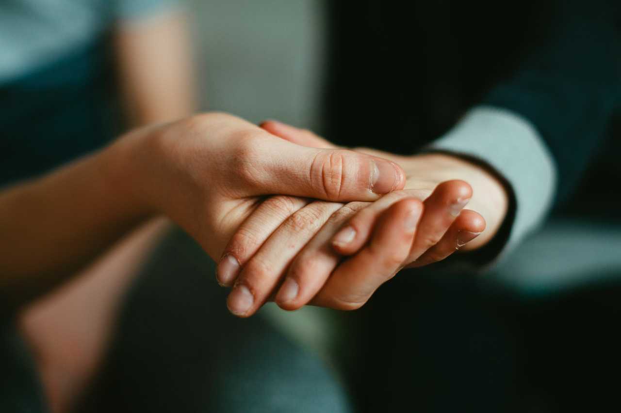 hands held for sympathy for loss of father