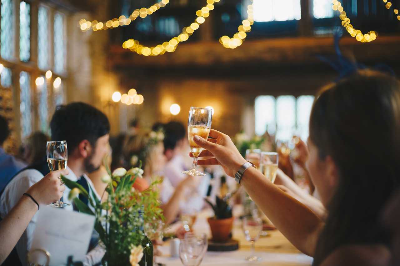 people celebrating with raised glasses the ai congratulation messages generated