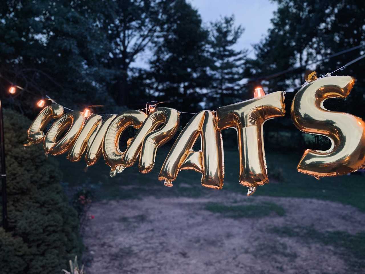 congrats messages written in balloons in a rope for law graduates