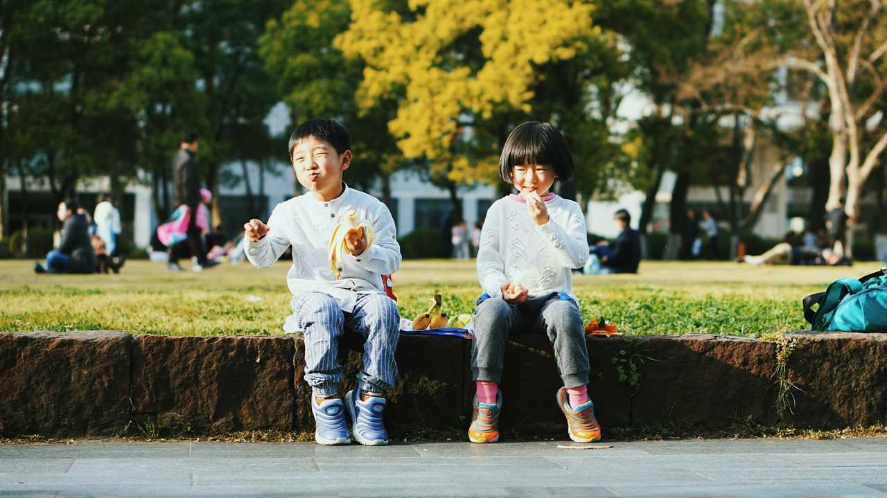 brother and sister eating in a park to share sister quotes